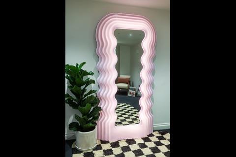 Retro curved pink-framed mirror in store at By Rotation, Belgravia